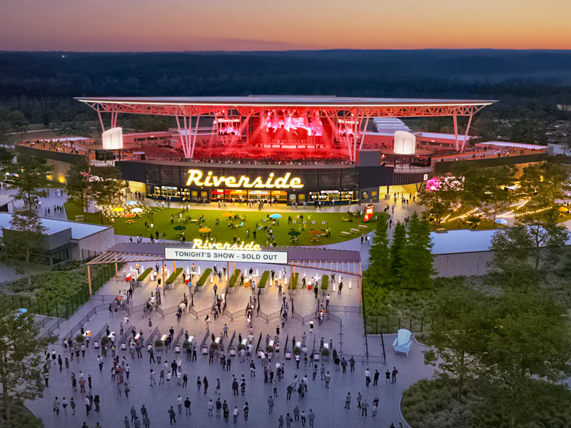 A vibrant outdoor amphitheater showcasing live performances as part of Live Nation's expansion plans with new venues coming to the US in 2026.